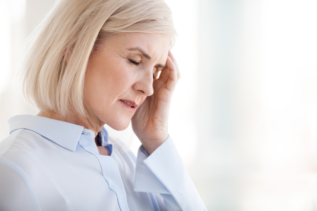 Man sneezing into tissue due to seasonal allergies that may be reduced with yeast fermentate